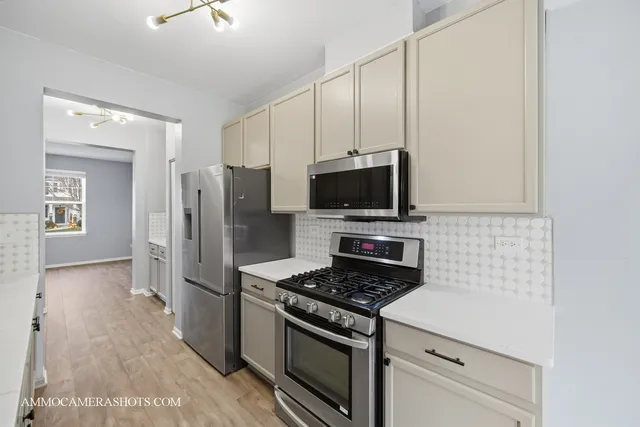 a kitchen with a stove and a microwave