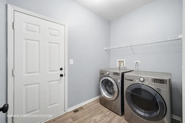 a view of storage and utility room with washer and dryer