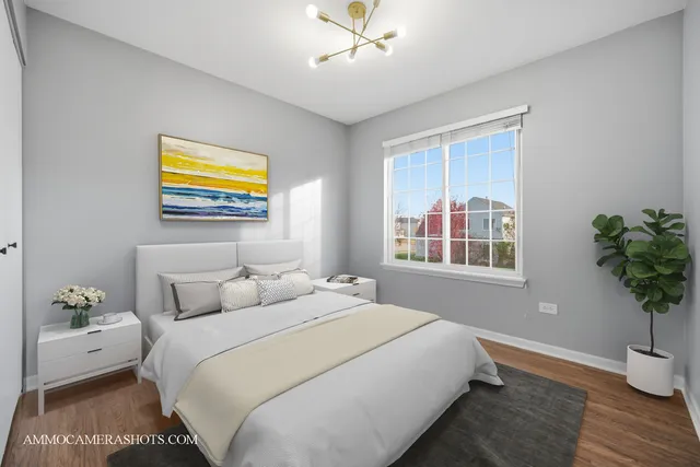 a bedroom with bed and a window