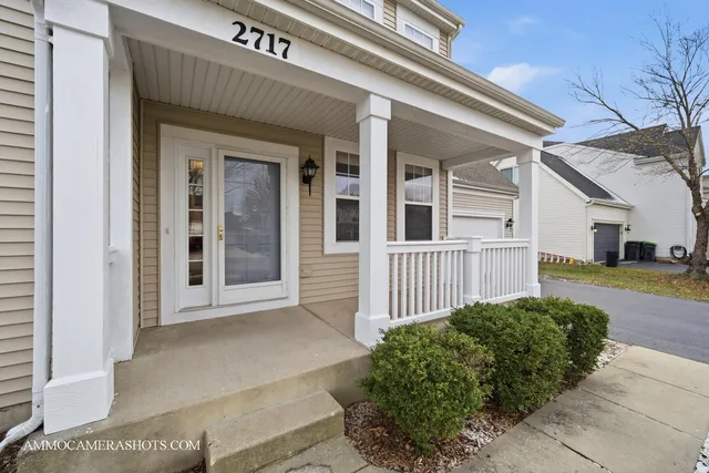 a view of a house with a small yard