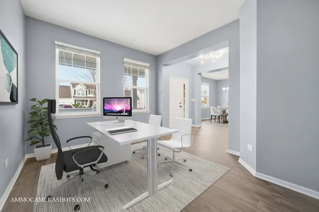 a workspace with furniture and window