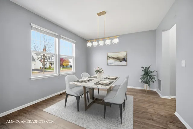 a dining room with furniture and window