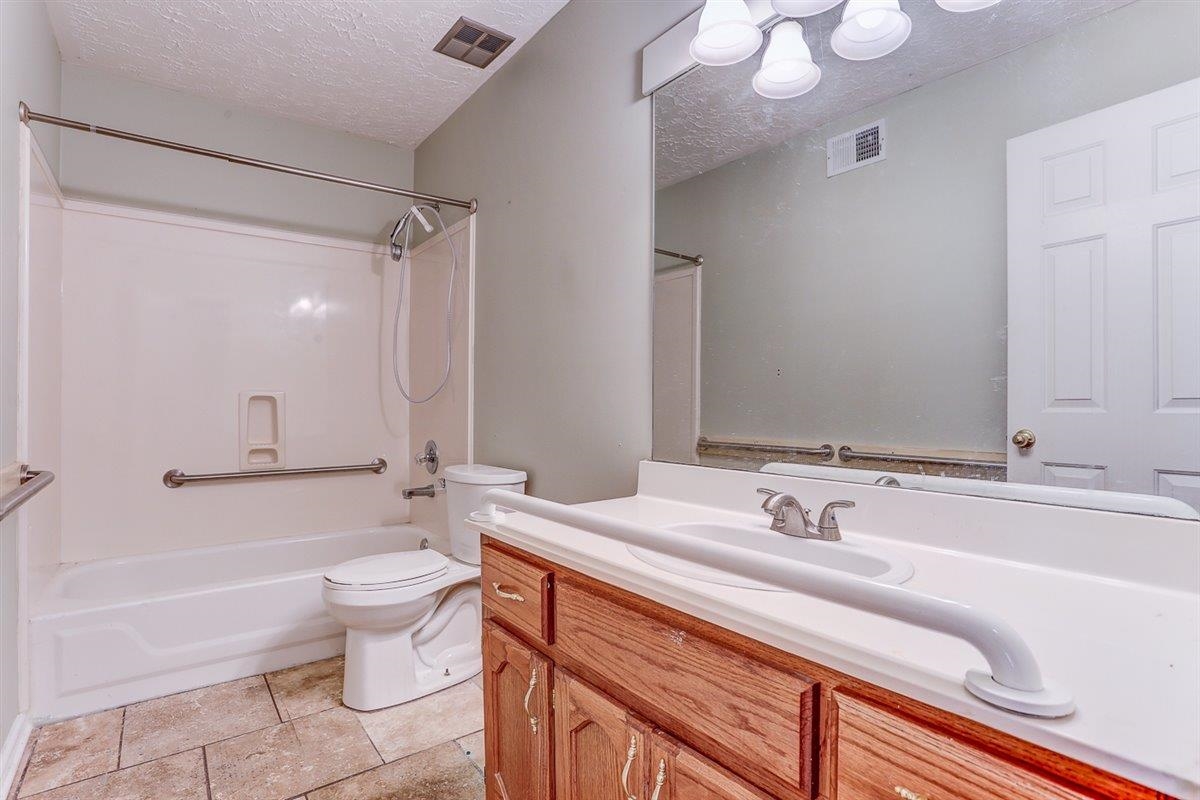 775 Silverman Drive Collierville, TN 38017 - Photo 11 of 17 a bathroom with a sink a toilet and shower