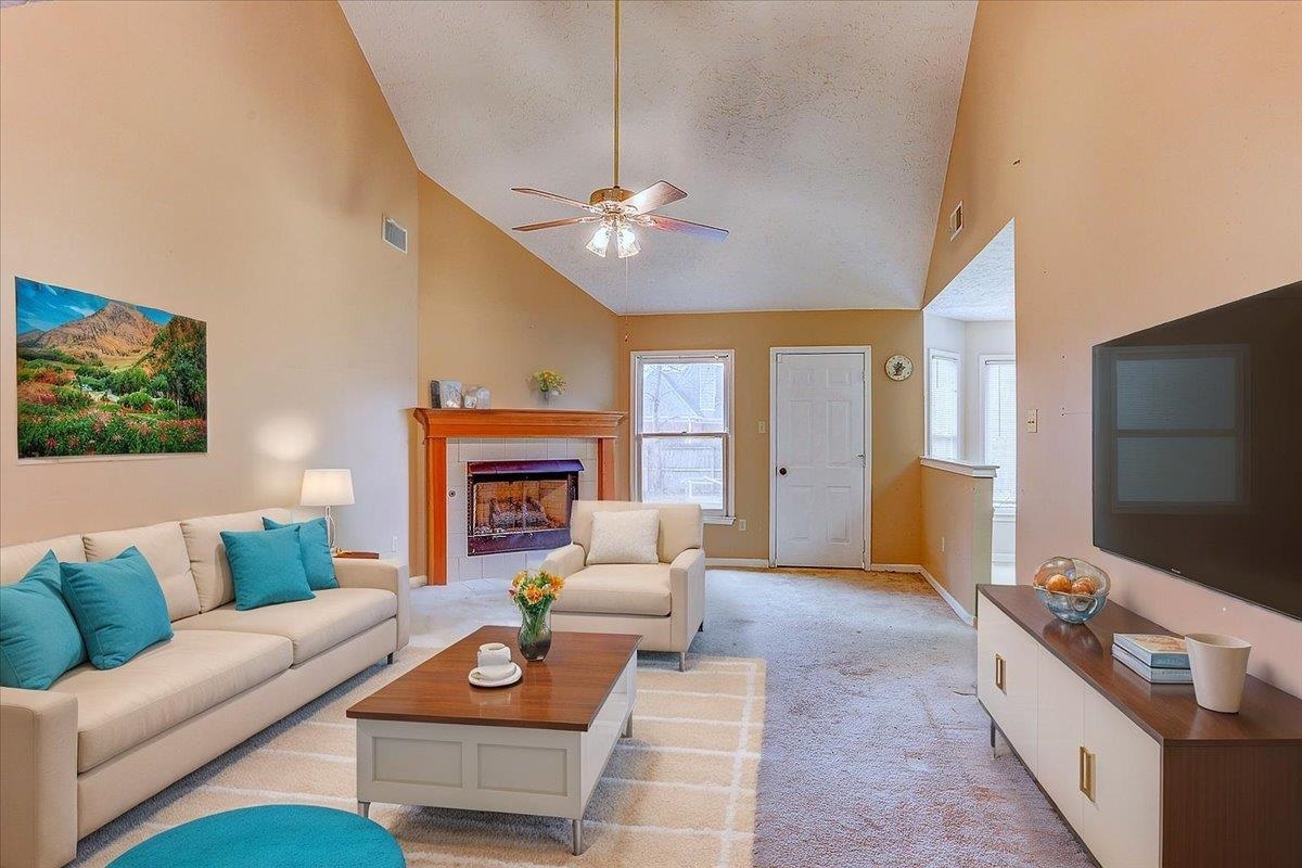 775 Silverman Drive Collierville, TN 38017 - Photo 16 of 17 a living room with furniture a fireplace and a flat screen tv