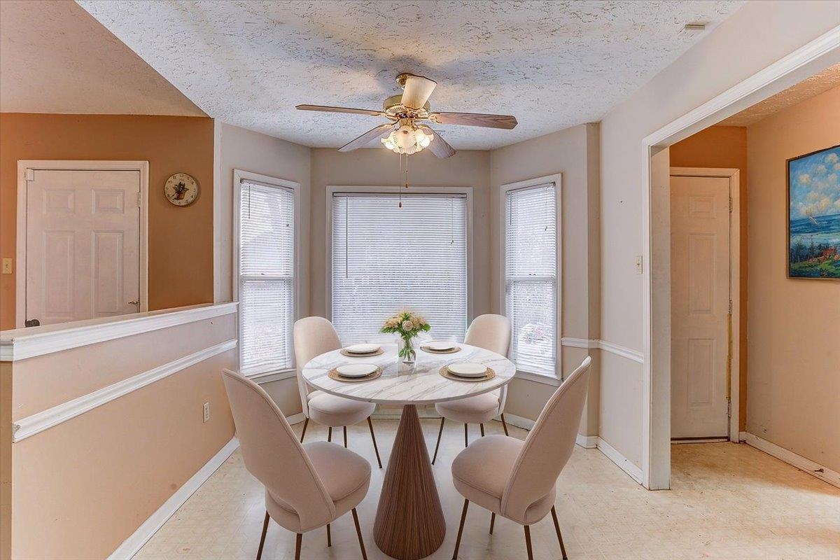 775 Silverman Drive Collierville, TN 38017 - Photo 4 of 17 a view of a dining room with furniture and chandelier
