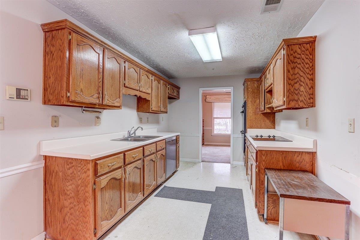 775 Silverman Drive Collierville, TN 38017 - Photo 5 of 17 a kitchen with stainless steel appliances granite countertop a stove and a sink