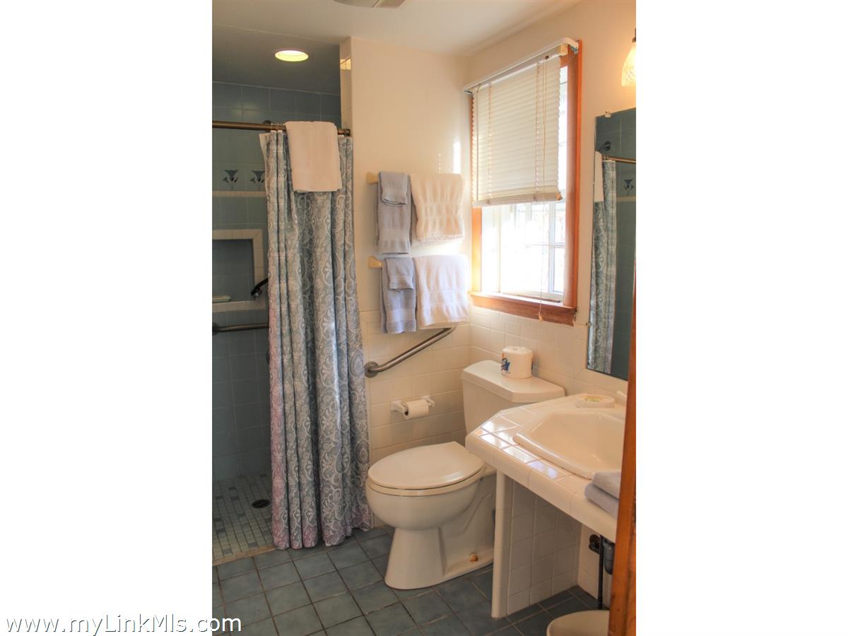 8 Sea Street Nantucket, MA 02554 - Photo 6 of 7 a bathroom with a toilet a sink and a shower