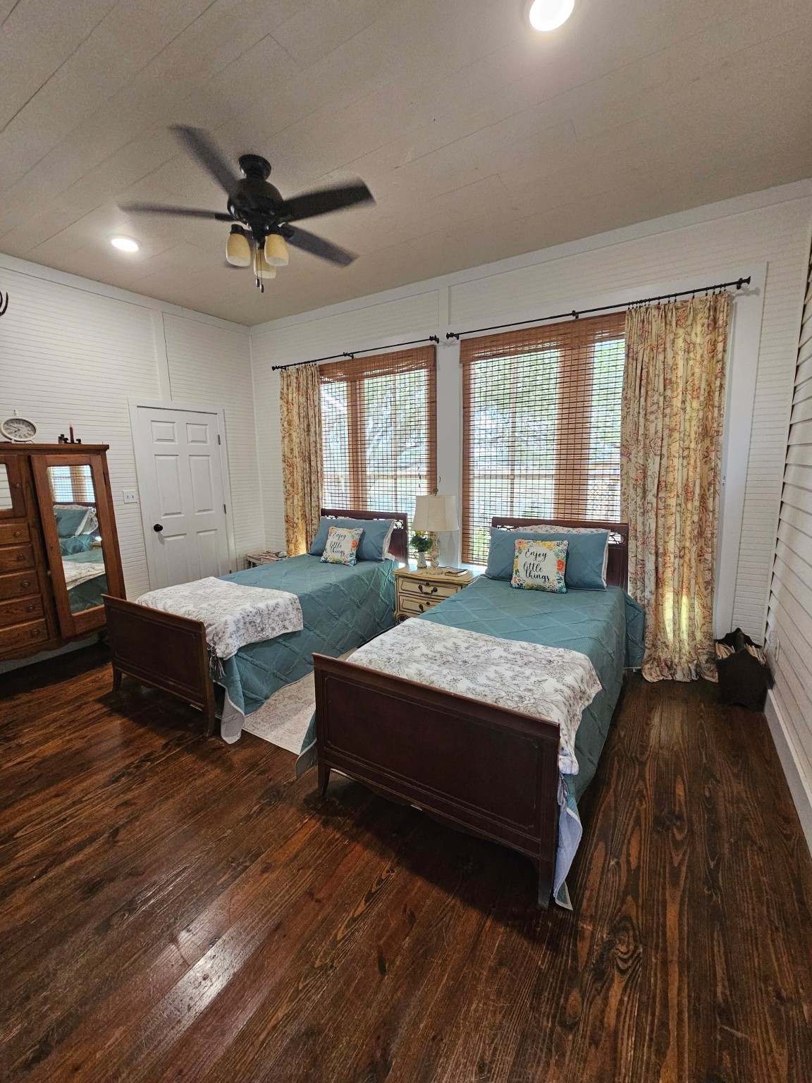 1098 Post Oak Point Road Fayetteville, TX 78940 - Photo 11 of 14 a spacious bedroom with a bed a chandelier and a dresser
