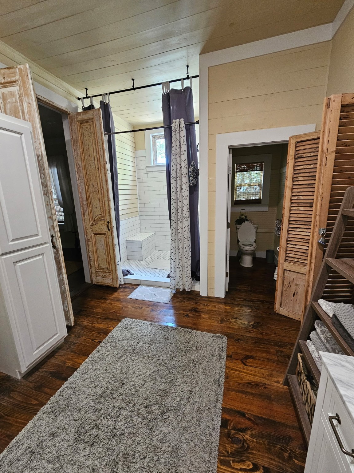 1098 Post Oak Point Road Fayetteville, TX 78940 - Photo 6 of 14 a view of front door and bedroom with wooden floor