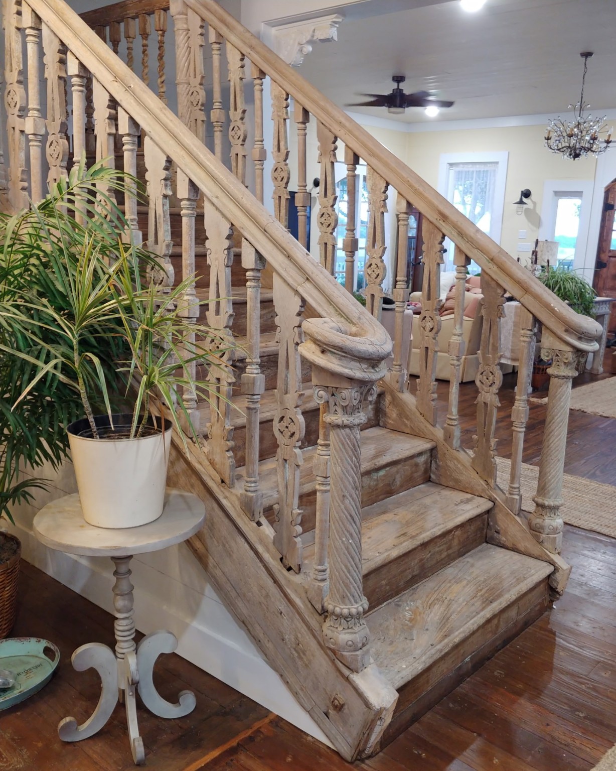 1098 Post Oak Point Road Fayetteville, TX 78940 - Photo 7 of 14 a view of staircase with wooden floor and a potted plant