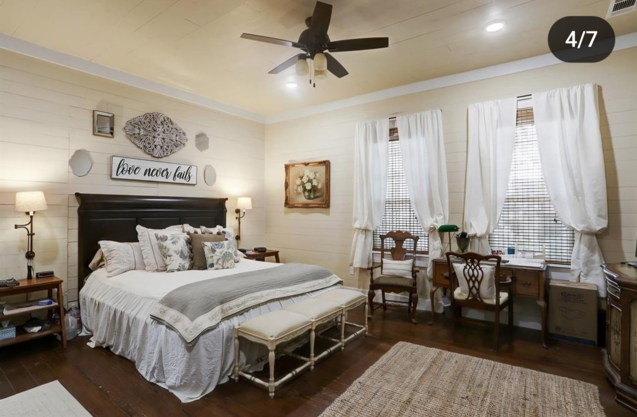 1098 Post Oak Point Road Fayetteville, TX 78940 - Photo 8 of 14 a bedroom with a bed a chandelier and a dresser