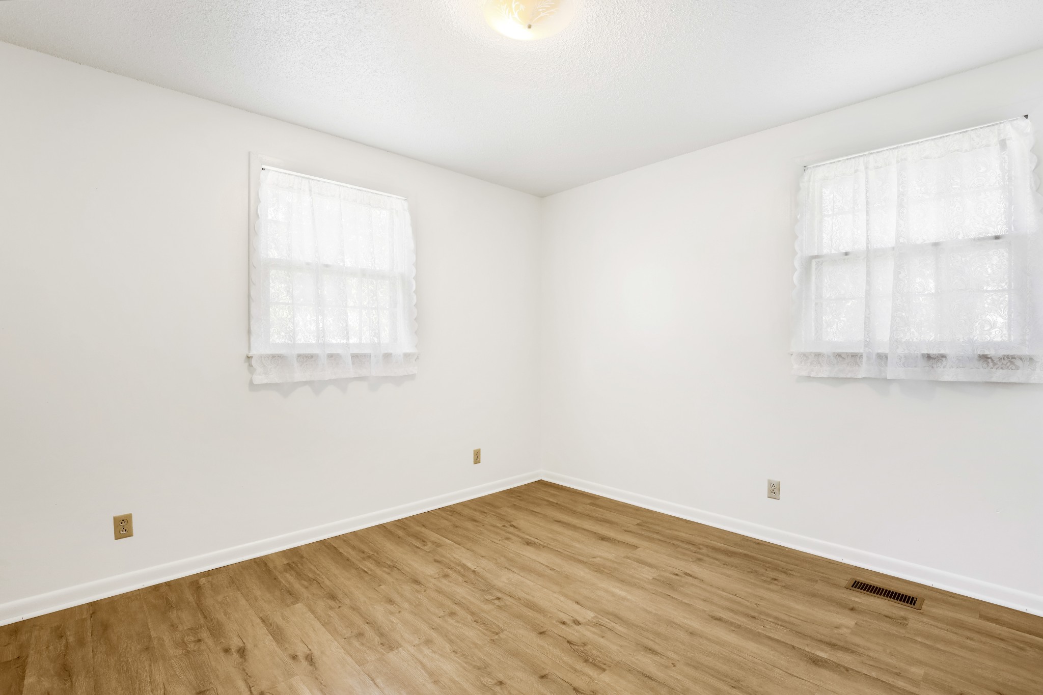 4169 Allison Lane Springfield, TN 37172 - Photo 18 of 21 an empty room with wooden floor and windows