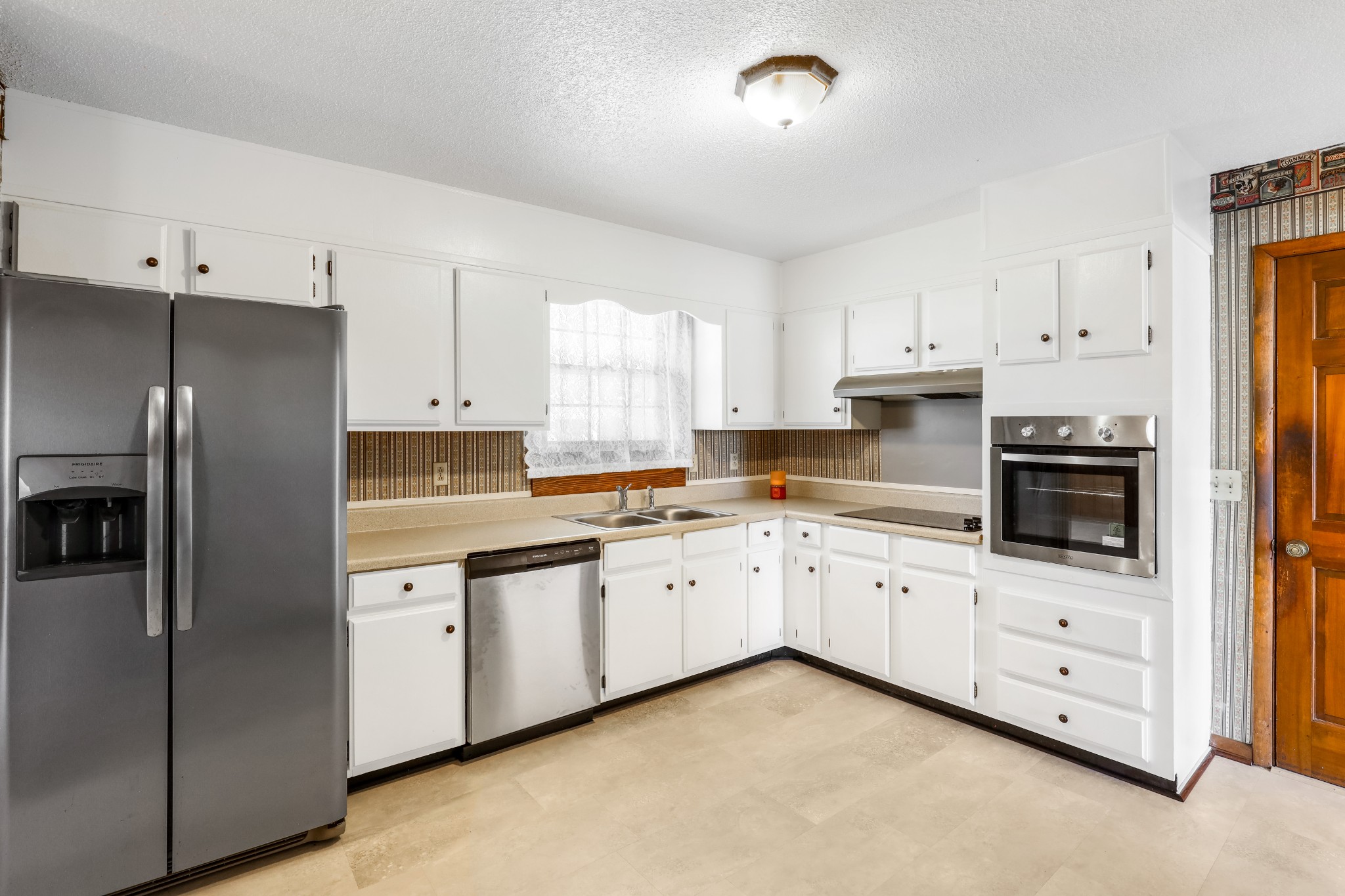 4169 Allison Lane Springfield, TN 37172 - Photo 9 of 21 a kitchen with granite countertop white cabinets and stainless steel appliances