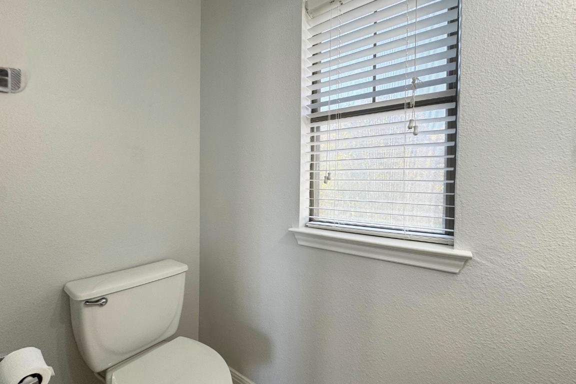 11203 Ranch Road 2222, Unit 2203 Austin, TX 78730 - Photo 21 of 34 a white toilet sitting next to a window