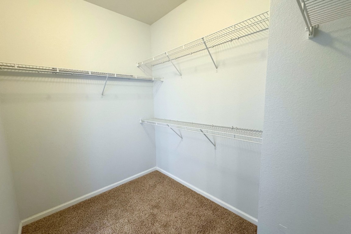 11203 Ranch Road 2222, Unit 2203 Austin, TX 78730 - Photo 28 of 34 a view of a room with racks on the wall