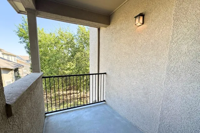 a view of a balcony with an outdoor space
