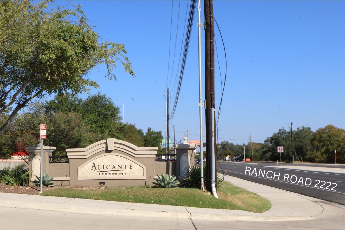 11203 Ranch Road 2222, Unit 2203 Austin, TX 78730 - Photo 3 of 34 a view of a street with a building and a big yard