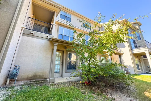 a view of a building with a tree