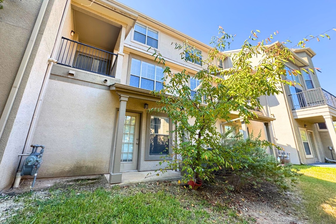 11203 Ranch Road 2222, Unit 2203 Austin, TX 78730 - Photo 32 of 34 a view of a building with a tree