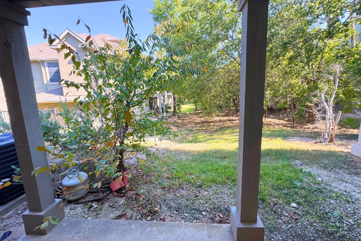 11203 Ranch Road 2222, Unit 2203 Austin, TX 78730 - Photo 33 of 34 a view of a porch with potted plants