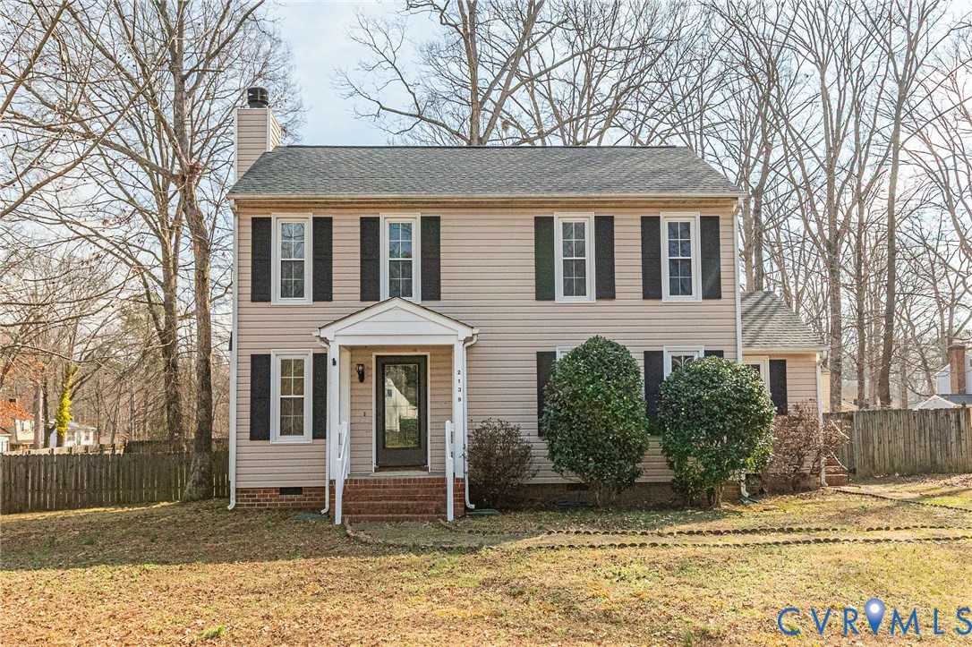 2139 Esquire Road North Chesterfield, VA 23235 - Photo 1 of 35 a view of a white house with large windows next to a road
