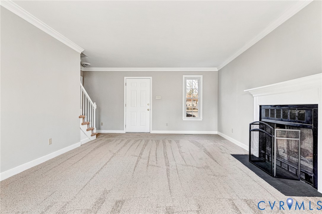 2139 Esquire Road North Chesterfield, VA 23235 - Photo 18 of 35 an empty room with a fireplace and a window