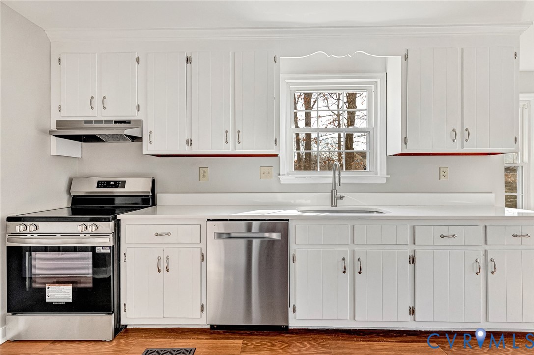 2139 Esquire Road North Chesterfield, VA 23235 - Photo 2 of 35 a kitchen with granite countertop white cabinets and window