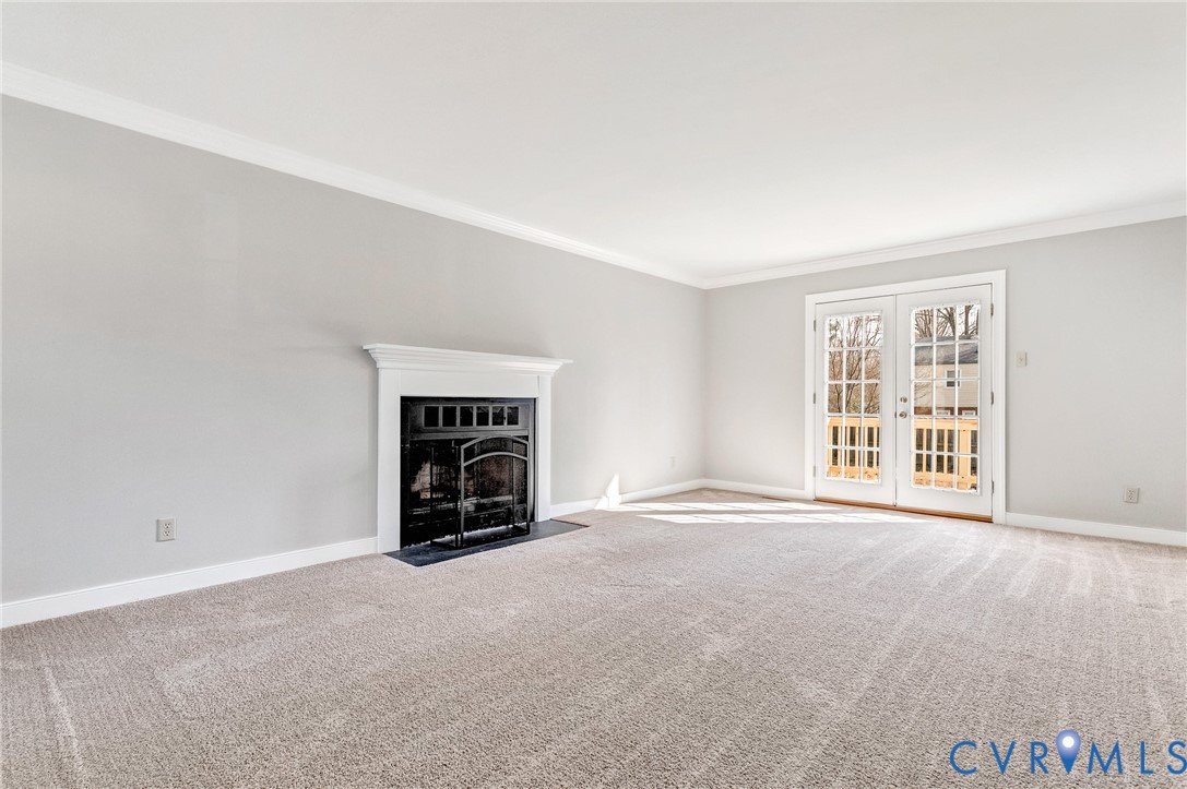 2139 Esquire Road North Chesterfield, VA 23235 - Photo 21 of 35 a view of an empty room with a fireplace and a window