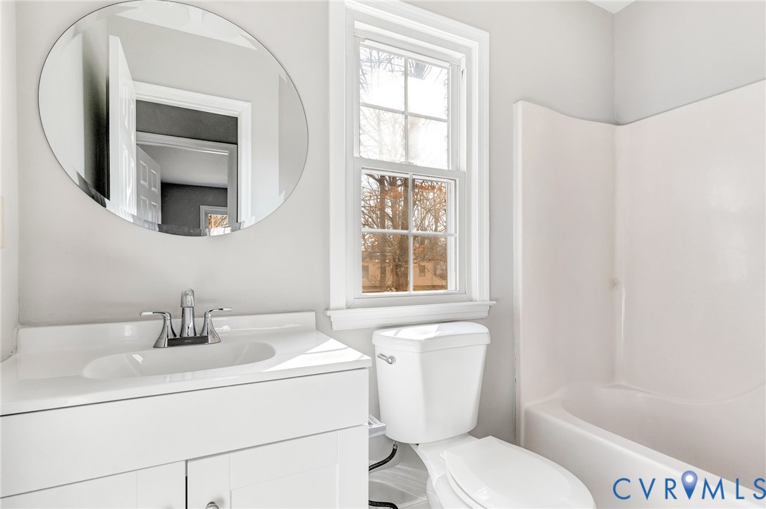 2139 Esquire Road North Chesterfield, VA 23235 - Photo 26 of 35 a bathroom with a toilet sink and mirror