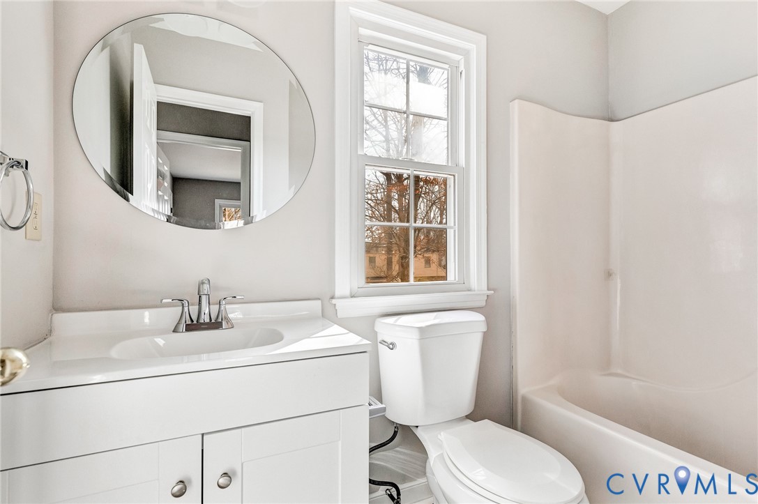 2139 Esquire Road North Chesterfield, VA 23235 - Photo 32 of 35 a bathroom with a toilet a sink and a mirror