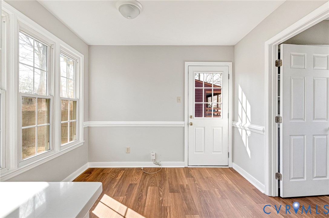 2139 Esquire Road North Chesterfield, VA 23235 - Photo 4 of 35 an empty room with wooden floor and windows