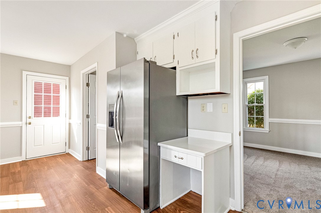 2139 Esquire Road North Chesterfield, VA 23235 - Photo 9 of 35 a view of a kitchen with refrigerator and wooden floor