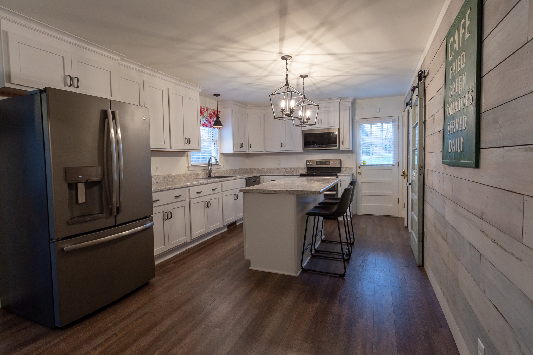 2091 Landon Road Clarksville, TN 37043 - Photo 3 of 21 a kitchen with refrigerator cabinets and wooden floor
