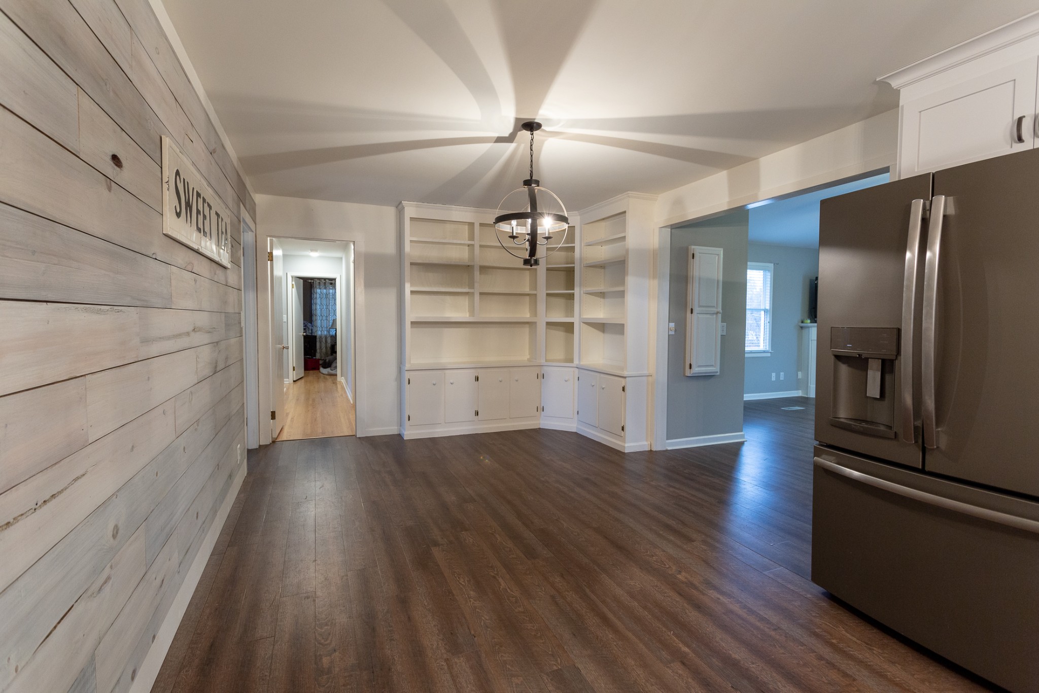 2091 Landon Road Clarksville, TN 37043 - Photo 5 of 21 wooden floor in an empty room with a kitchen