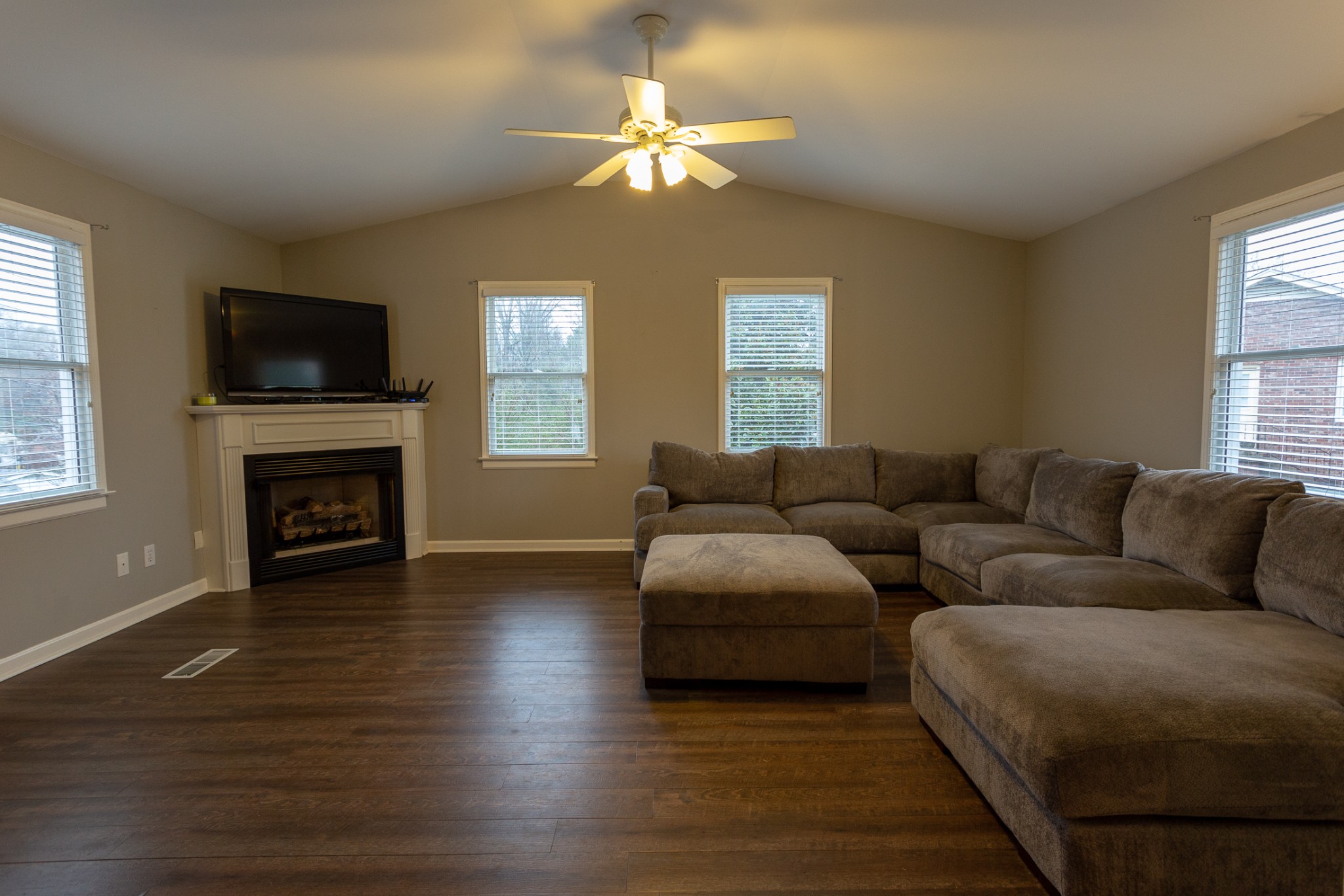 2091 Landon Road Clarksville, TN 37043 - Photo 6 of 21 a living room with furniture a flat screen tv and a fireplace