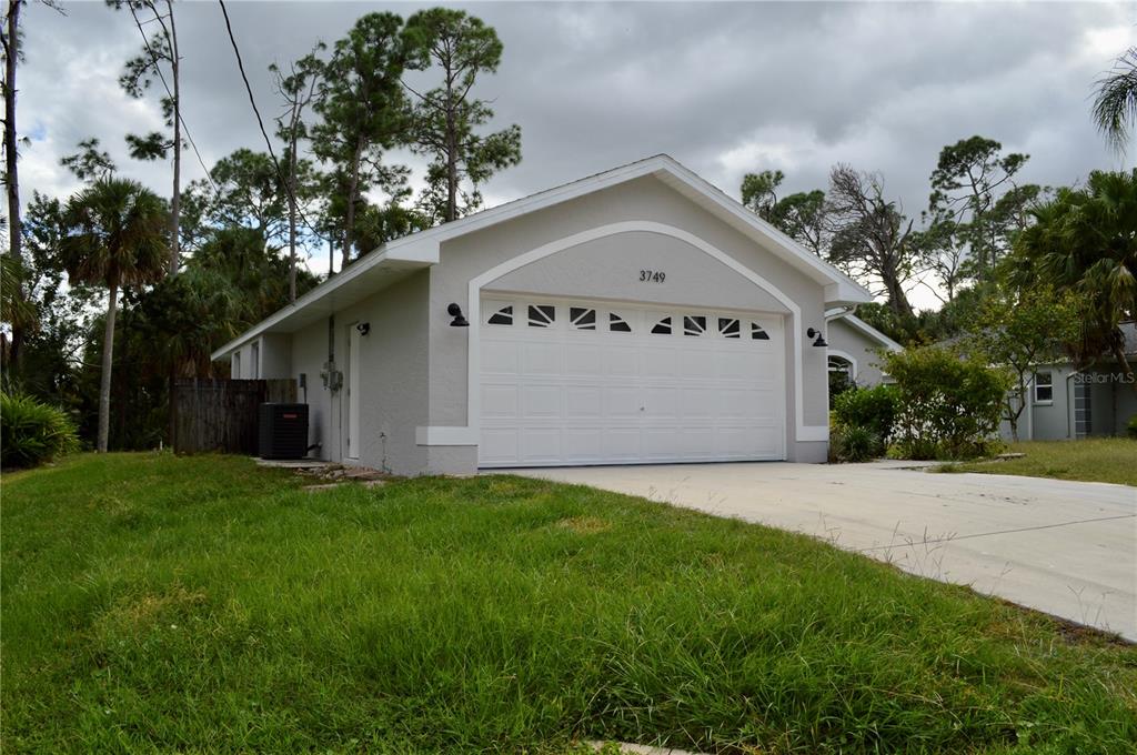 3749 Inagua Avenue North Port, FL 34286 - Photo 1 of 1 a view of a house with a yard