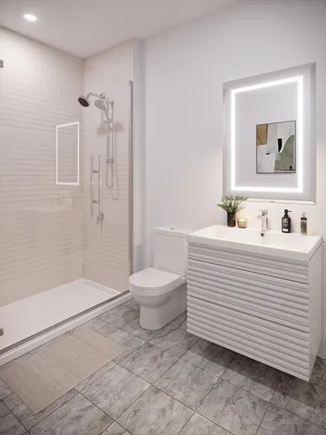 a bathroom with a sink toilet and shower