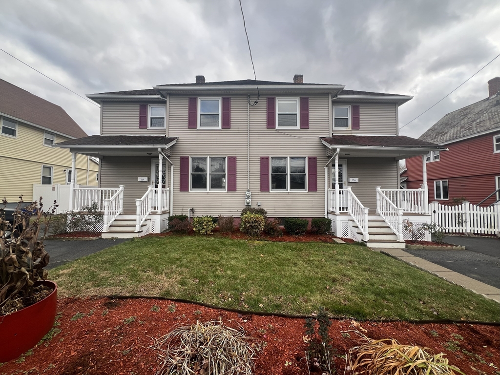 358 East Street, Unit 358 Ludlow, MA 01056 - Photo 1 of 10 a front view of a house with a garden