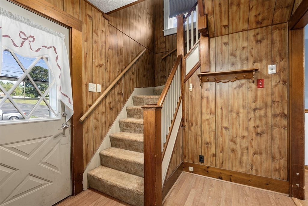 358 East Street, Unit 358 Ludlow, MA 01056 - Photo 3 of 10 a view of staircase with wooden floor and white walls