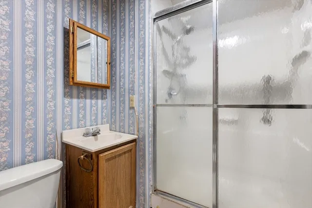 a bathroom with a sink and mirror