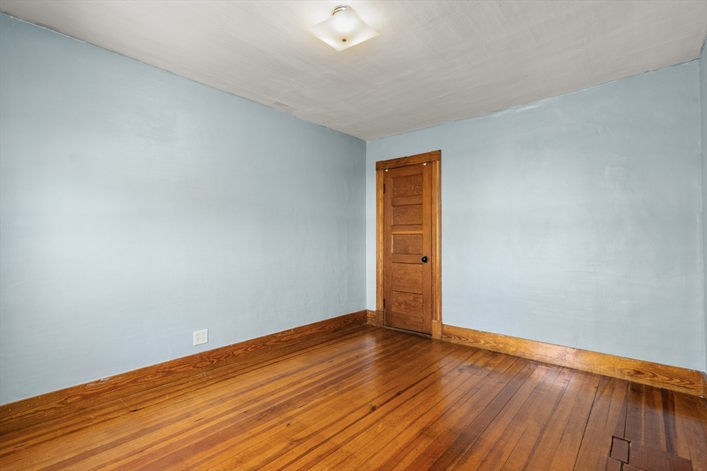 358 East Street, Unit 358 Ludlow, MA 01056 - Photo 9 of 10 a view of an empty room with wooden floor