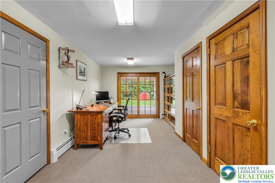 2750 Belaire Road Bethlehem, PA 18017 - Photo 8 of 56 Sliding doors open to the backyard from this versatile lower level workspace.