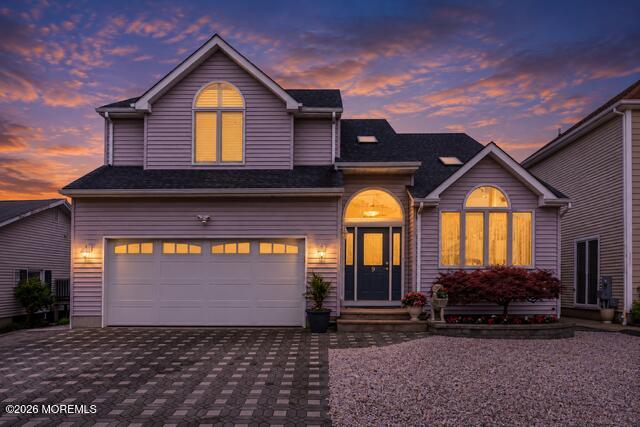 9 Cross Trees Road Brick, NJ 08723 - Photo 125 of 126 a front view of a house with a yard and garage