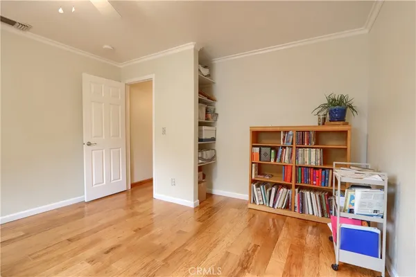 a view of room with furniture and book shelf