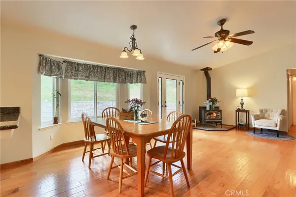 a dining room with furniture and window