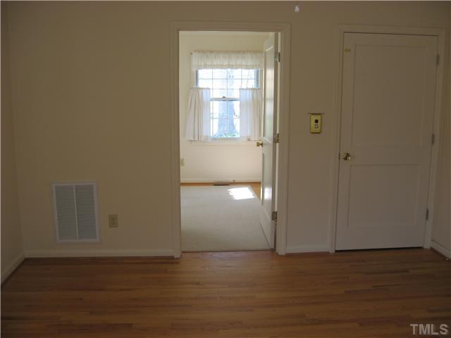 719 Runnymede Road Raleigh, NC 27607 - Photo 17 of 25 Fourth bed room with sitting area has beautiful hardwood floors and could be used as an office with work room. Bedroom