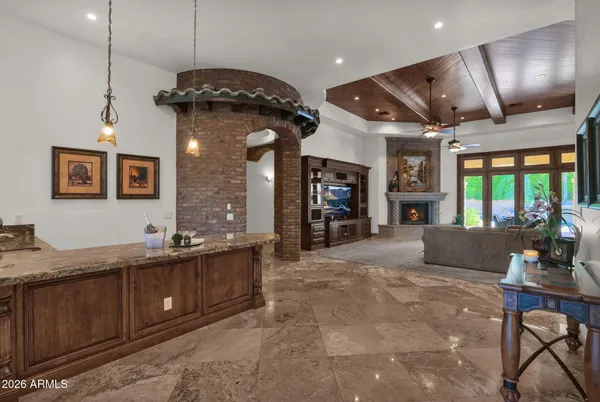 a living room with fireplace furniture and a flat screen tv