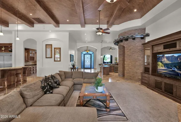 a kitchen with granite countertop a table and chairs in it