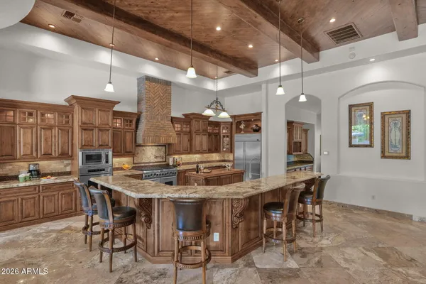 a kitchen with a sink and a stove