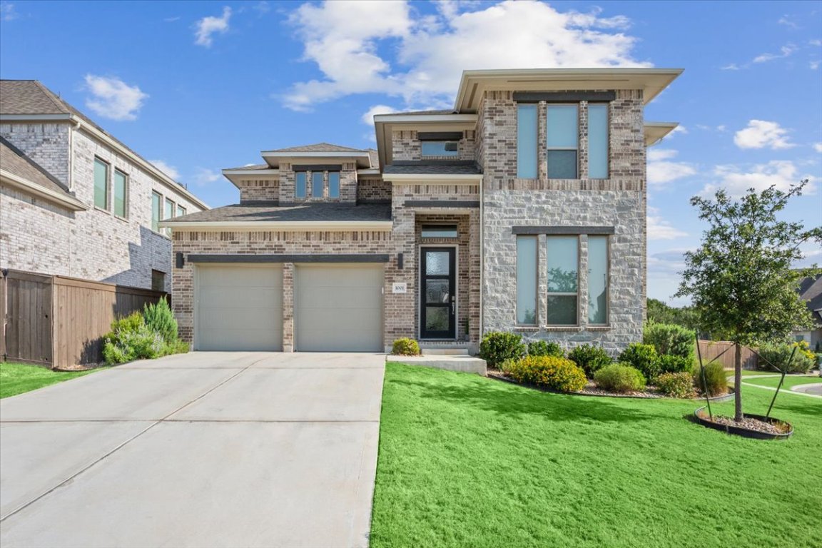 1001 Rabbit Brush Road Leander, TX 78641 - Photo 1 of 1 a front view of a house with a garden